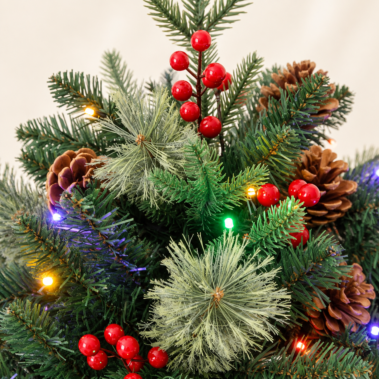 Close-up of mixed green needles, red berry clusters, pinecones, and multicolor lights on the Christmas urn filler. AI-generated detail illustration based on the original product image.